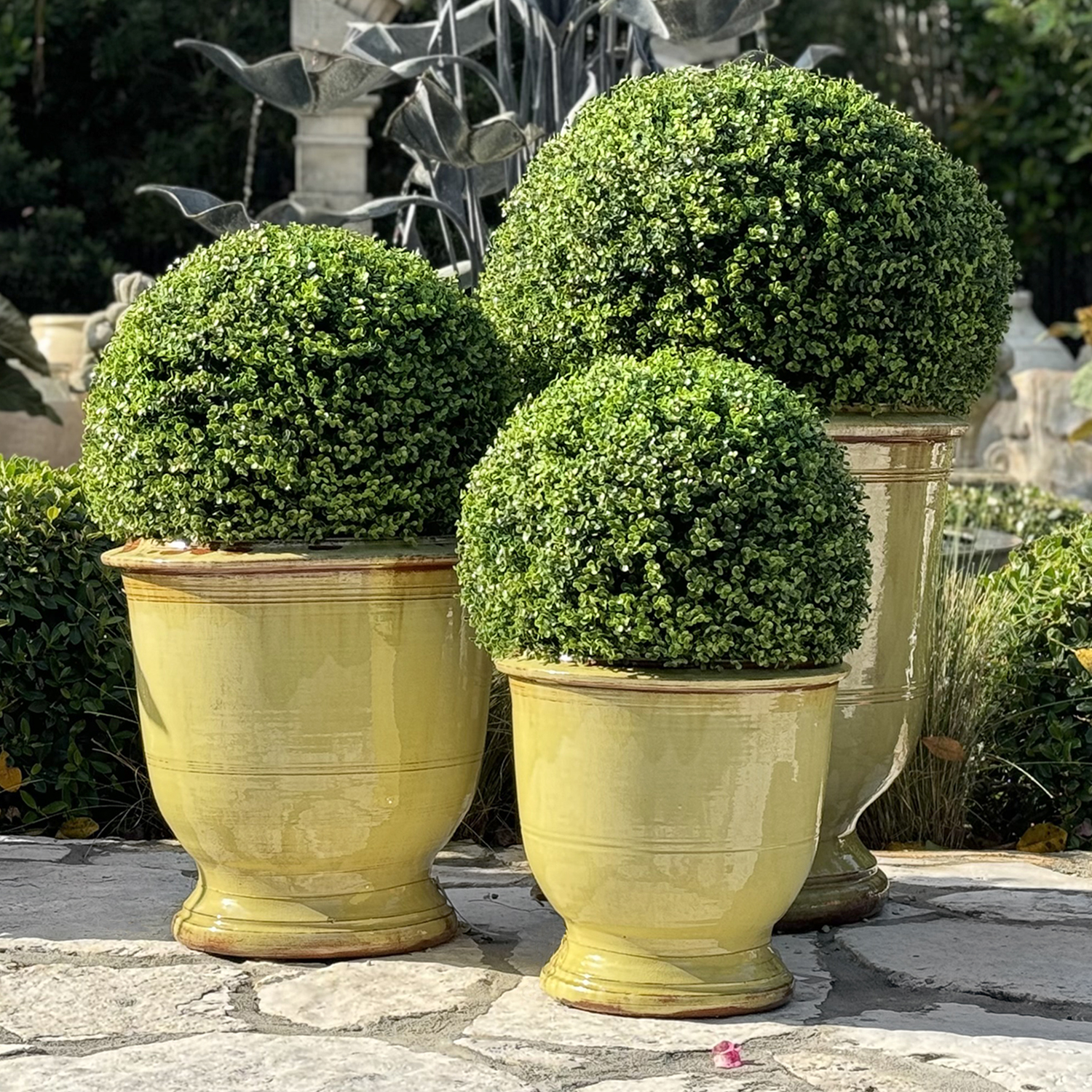 The Anduze garden planter has a fully glazed finish. This light yelllow terra cotta clay urn is hand made in Provence, France.