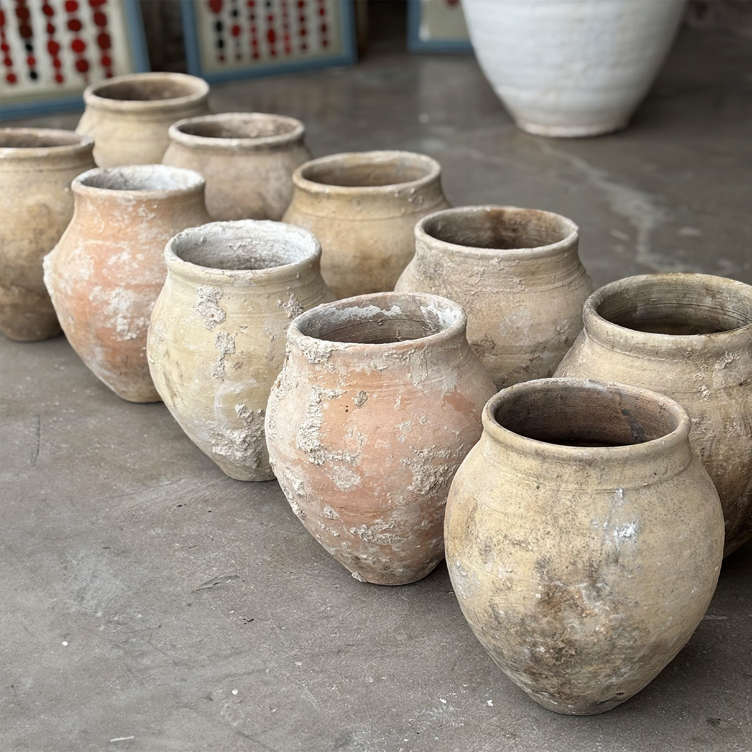 A Set of Eleven Weathered Mediterranean Pots in Earthenware