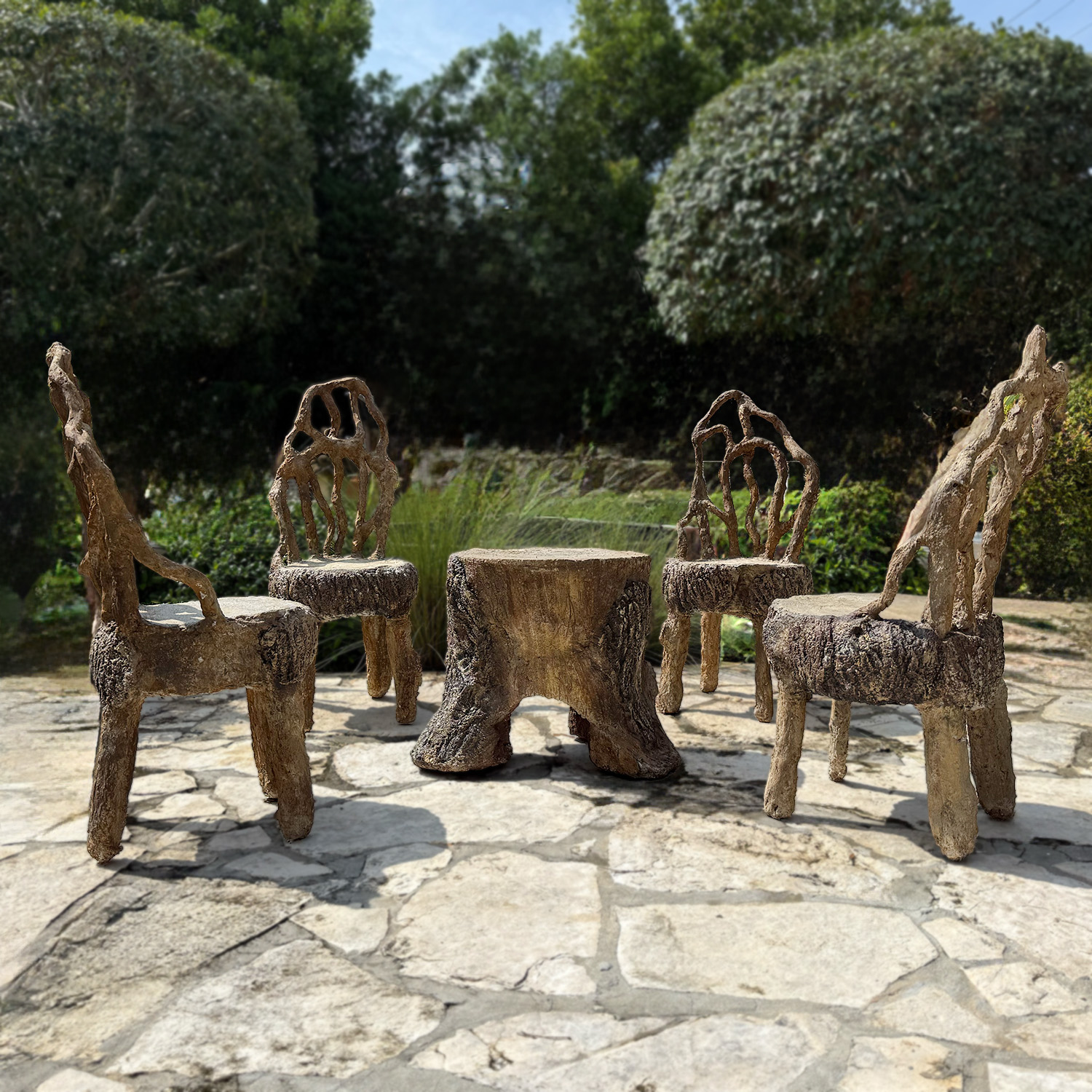 Vintage French rocaille faux bois concrete garden chairs and table with sculptural branch detailing and authentic patina.