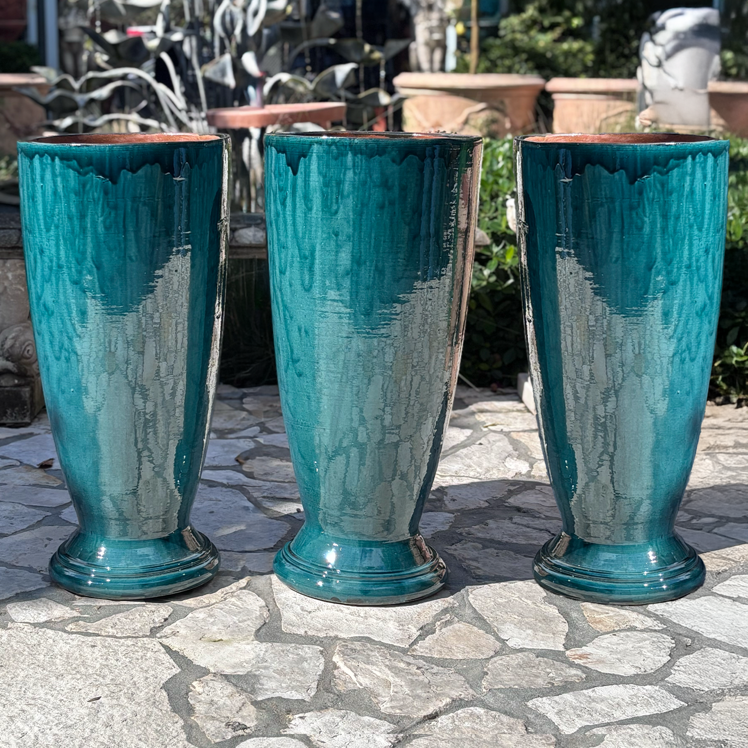 A Set of Three Turquoise Blue Ovoid Shaped Garden Planters on foot from Provence