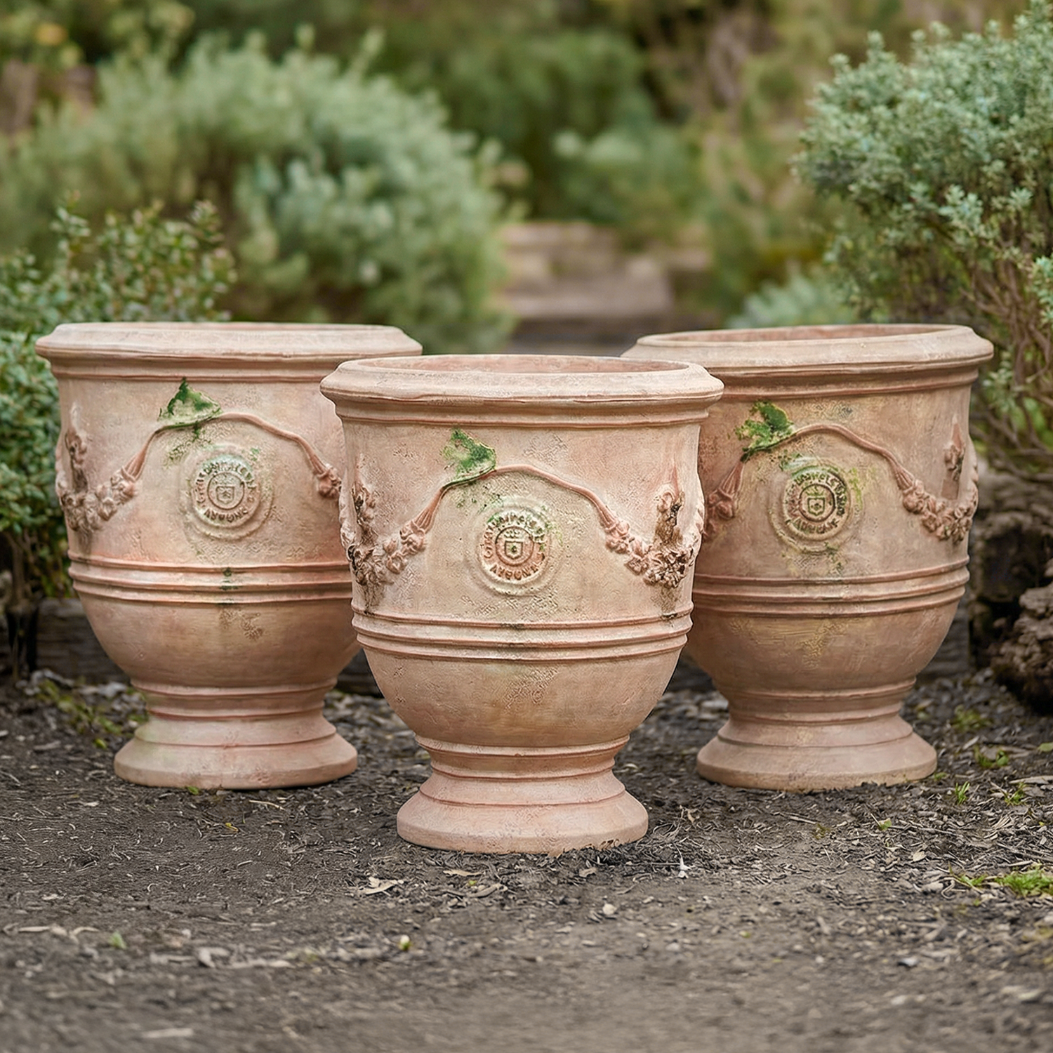 Set of Three Provencal Garden Urns with Mediallons and Fleur de Lys in terra cotta