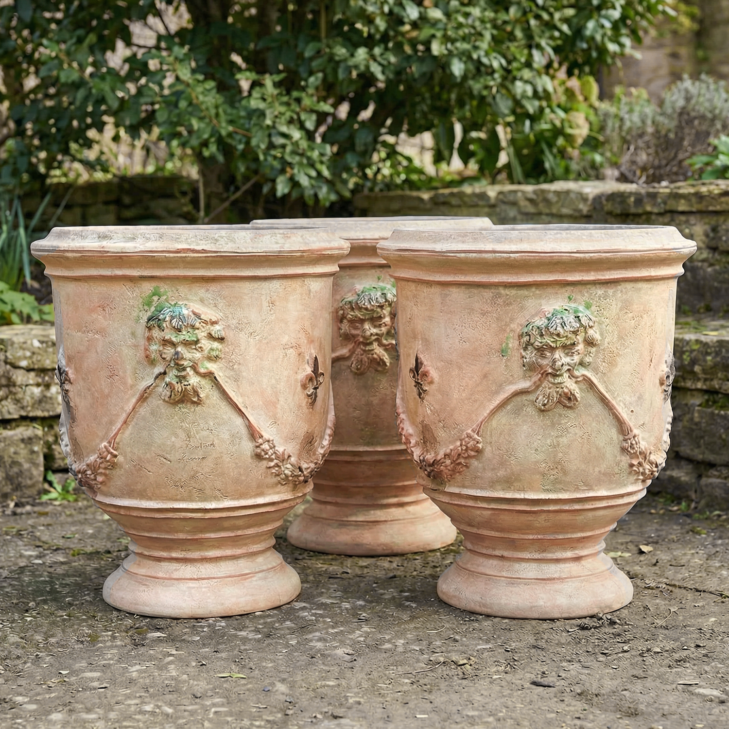 Set of Three Garden Pots from France with Antiqued Patina and Faunes and Fleurs de Lys