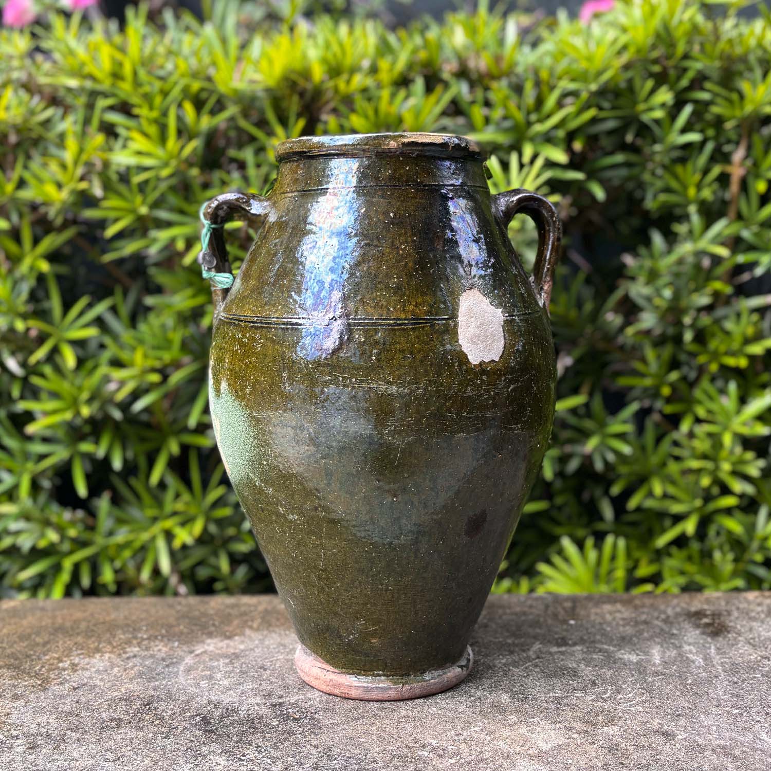 An Antique French Olive Jar with a Dark Green Glaze